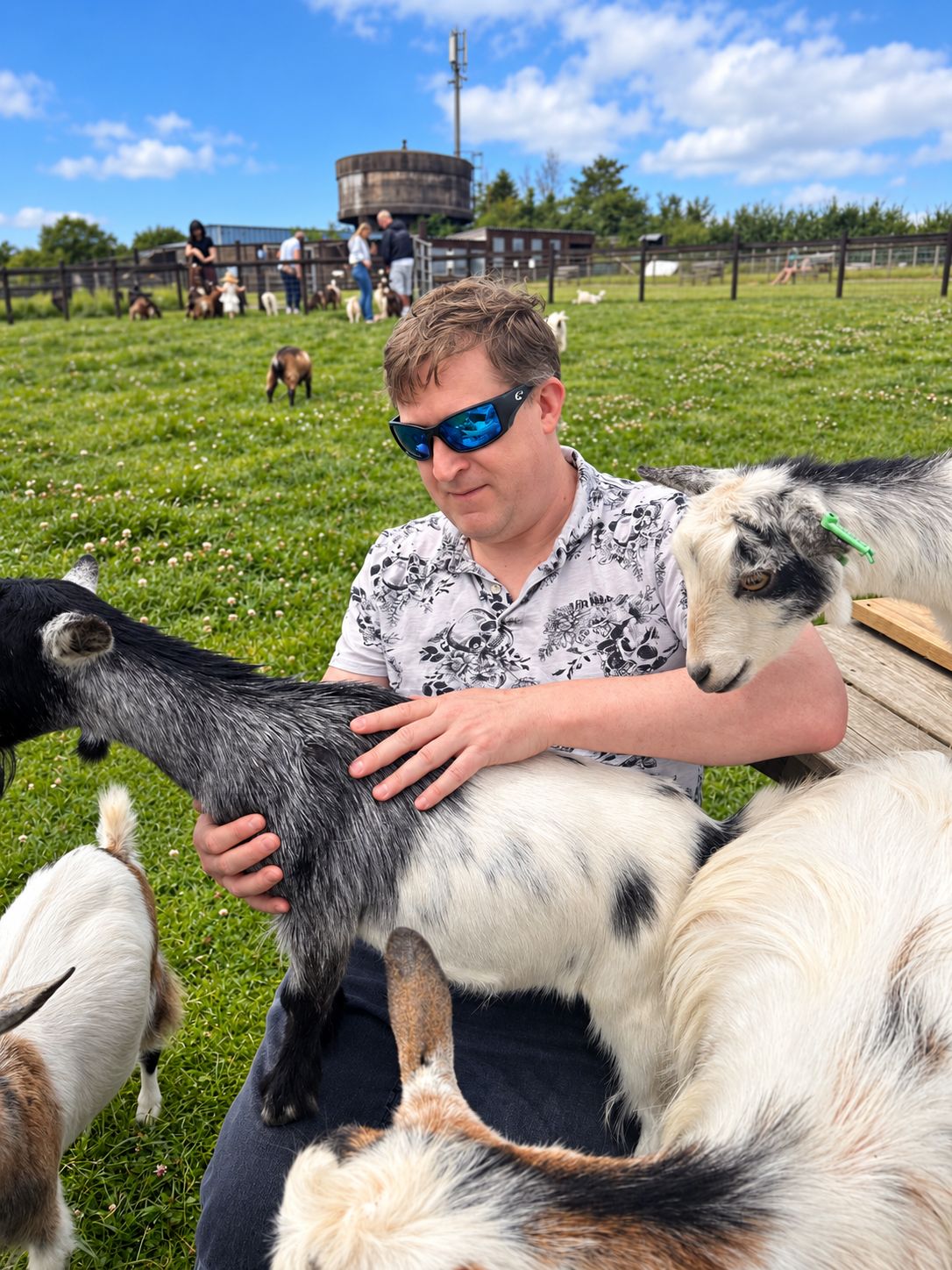 Gary enjoying some time with a very friendly group of goats
